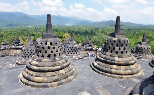 Borobudur stupas overlooking a mountain. For centuries it was deserted