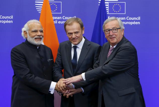 India's Prime Minister Narendra Modi (L) is welcomed by European Council President Donald Tusk (C) and European Commission President Jean-Claude Juncker at the EU-India Summit in Brussels, Belgium