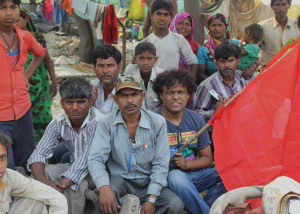 Abdul Shakeel Campaign coordinator at HLRN in the center with the homeless people at Mayur Vihar Phase 1
