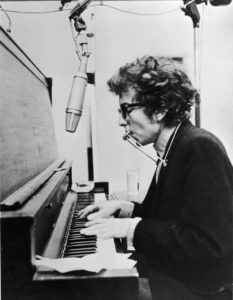 Dylan’s first professional recording was as a harmonica player at a Harry Belafonte session.