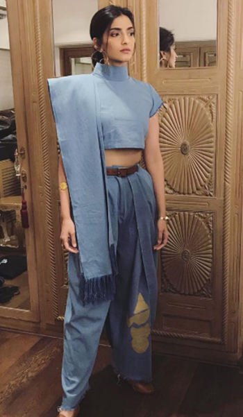 Bollywood actress Sonam Kapoor in her denim dhoti saree paired with a belt