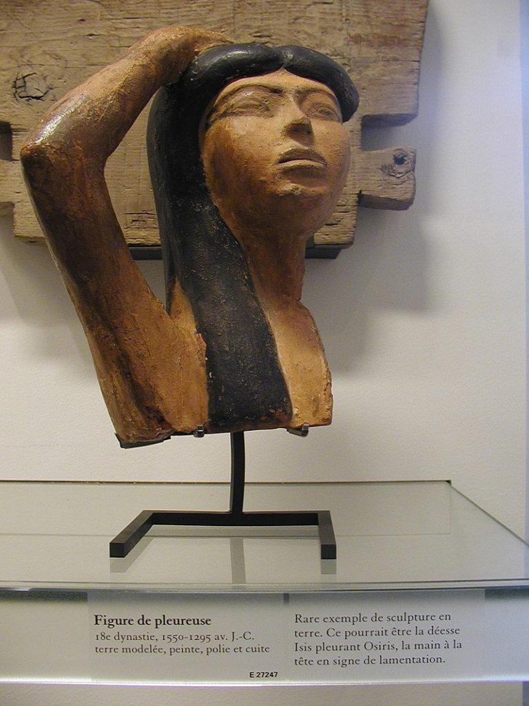 Terracotta head of Isis lamenting the loss of Osiris (Eighteenth Dynasty, Egypt) at Louvre Musuem, Paris