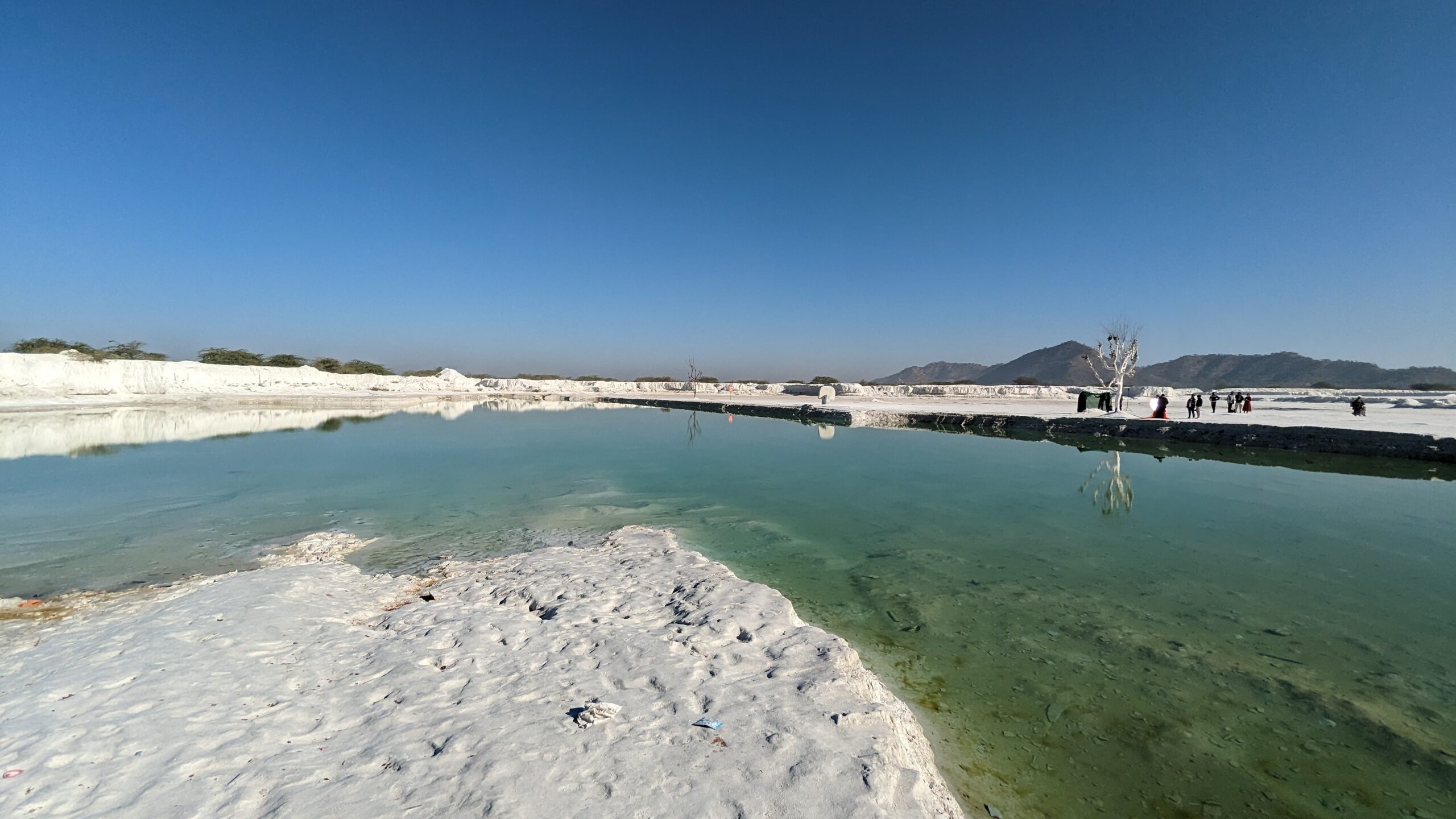 At sunrise and sunset, the terrain glows softly, transforming the waste heaps into a dreamlike setting